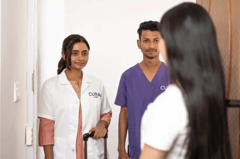 Dentist and dental assistant at doorstep