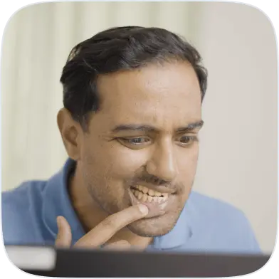 Man checking yellow and stained teeth